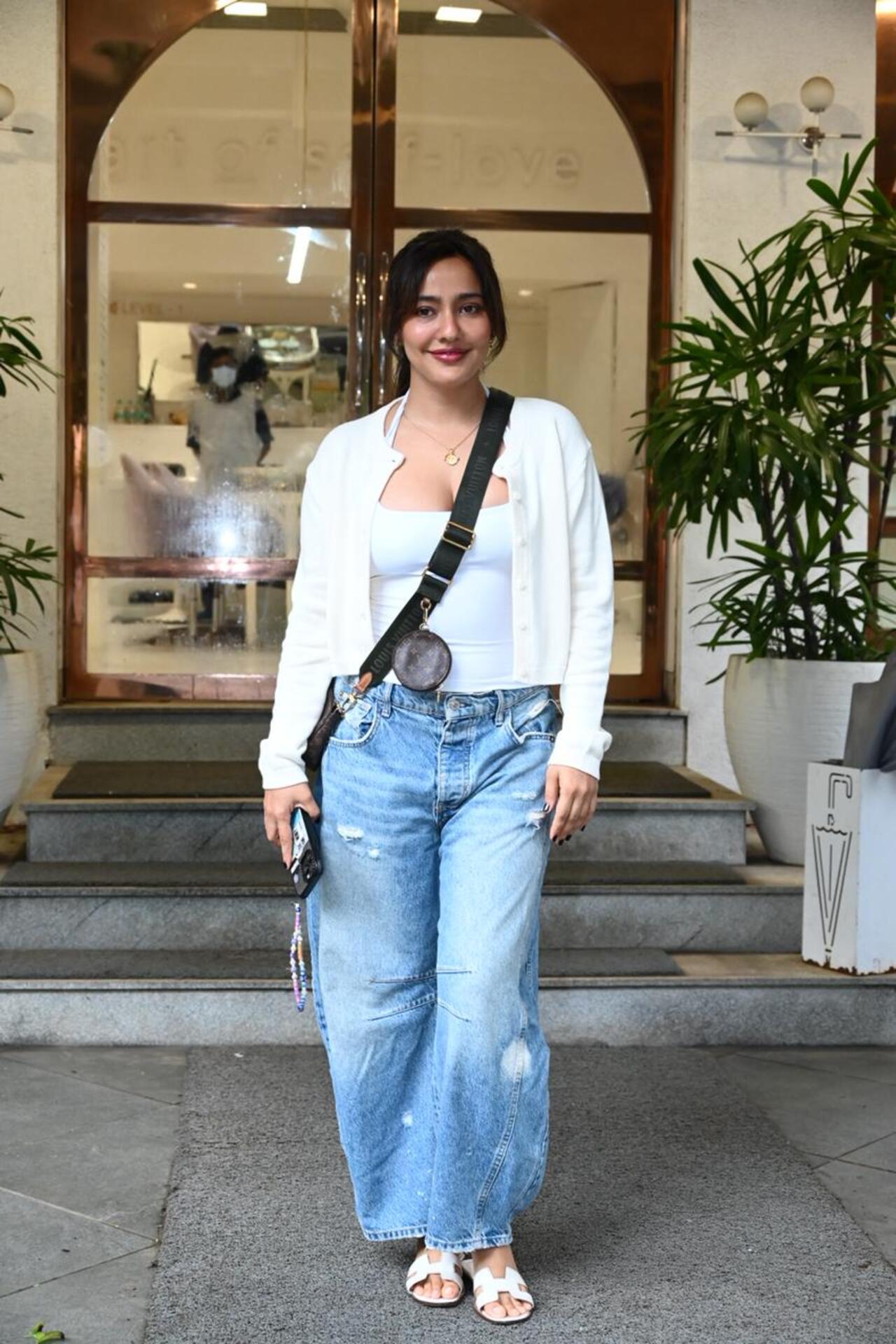 Neha Sharma was seen visiting a salon in the city dressed casually in a white shirt and blue jeans.